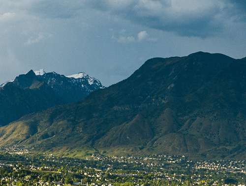 treetops rooftops water mountains